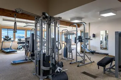 a fitness room with several treadmills and machines at Fraser 3BR Condo with Pool and Hot Tub in Fraser