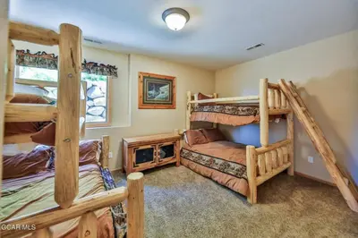 a bedroom with two bunk beds in a house at Rocky Mountain High - Pet Friendly in Grand Lake