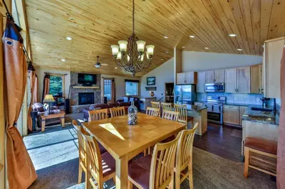 a kitchen and dining room with a wooden ceiling at Rocky Mountain High - Pet Friendly in Grand Lake