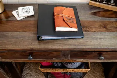 a book sitting on top of a wooden table at WP Top Floor Getaway in Winter Park
