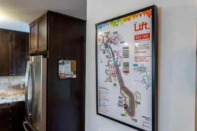 a sign on a wall next to a refrigerator at WP Top Floor Getaway in Winter Park