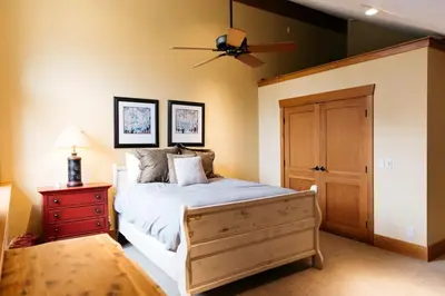a bedroom with a bed and a ceiling fan at Scenic Mountain Retreat in Fraser in Granby