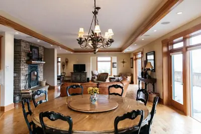 a dining room and living room with a table and chairs at Scenic Mountain Retreat in Fraser in Granby