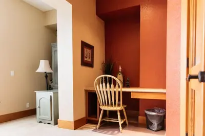 a hallway with a desk and a chair in a room at Scenic Mountain Retreat in Fraser in Granby