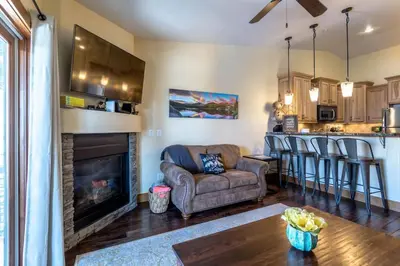 a living room with a couch and a fireplace at Love Grand Lake Townhouse Pet Friendly With garage in Grand Lake
