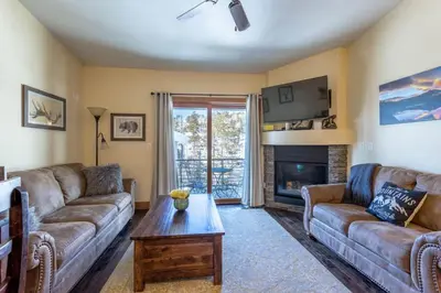 a living room with two couches and a fireplace at Love Grand Lake Townhouse Pet Friendly With garage in Grand Lake
