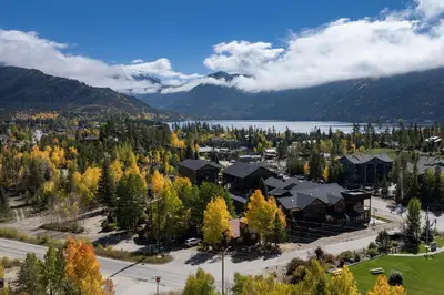 an aerial view of a resort with trees and a lake at Cozy Grand Lake Hideaway Walk to Lake and Restaurants in Grand Lake