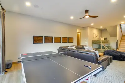 a living room with a ping pong table at Luxe Home with Hot Tub, Close to Winter Park Resort! in Fraser