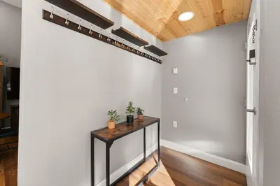 a hallway with a table against a wall at Lakeshore 1 in Keystone
