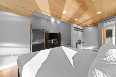 a bedroom with a bed and a wooden ceiling at Lakeshore 1 in Keystone
