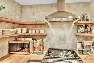 a kitchen with a stove top oven in a kitchen at Peaceful Ranch Overlooking Mustangs with Full Kitchen & Fireplace in Longmont