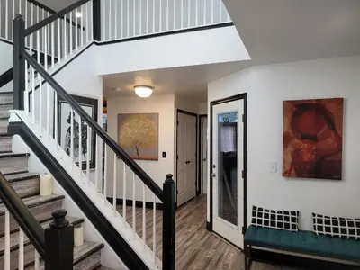 a staircase in a home with white walls at Denver Layover B&B in DEN