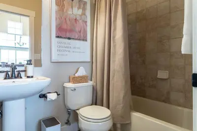 a bathroom with a toilet and a sink and a tub at 3 BR Private Mountain Retreat in Granby