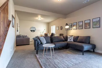 a living room with a couch and a table at 3 BR Private Mountain Retreat in Granby