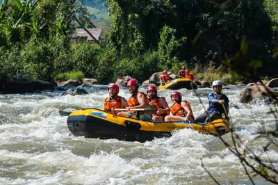 a group of people in a raft on a river at Luxury Getaway in Winter Park Fraser in Granby