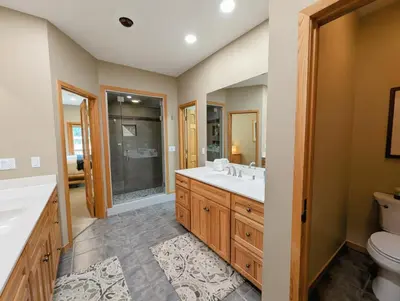 a bathroom with a sink and a toilet at Goldenrod Home 88 by SummitCove Lodging in Keystone