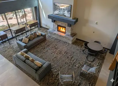 a living room with two couches and a fireplace at Springs 8886 by SummitCove Lodging in Keystone