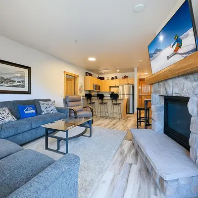 a living room with a couch and a fireplace at Dakota Lodge 8499 by SummitCove Lodging in Keystone