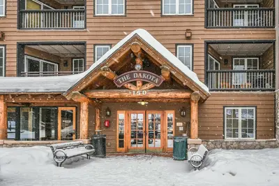 a building with a sign that reads first dance at Dakota Lodge 8499 by SummitCove Lodging in Keystone