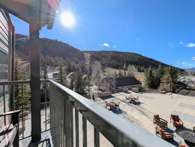 a balcony with a view of a patio at Slopeside 2793B by SummitCove Lodging in Keystone
