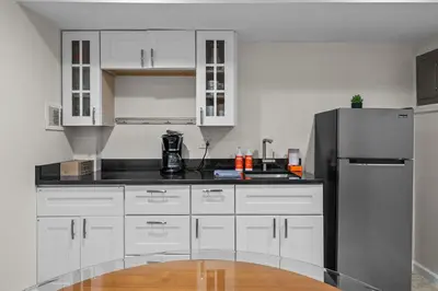 a kitchen with white cabinets and a refrigerator at 1815 Bluebell New in Boulder
