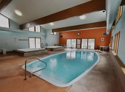 a large indoor swimming pool in a building at Lake & Mountain Views, 2BR, 2 BA in Dillon