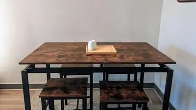 a wooden table with a candle on top of it at The Green House, RiNo in Denver