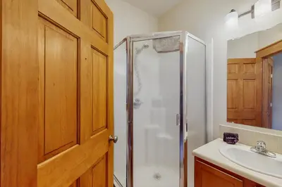 a bathroom with a shower and a sink at Grizzly Peak Lodge in Granby