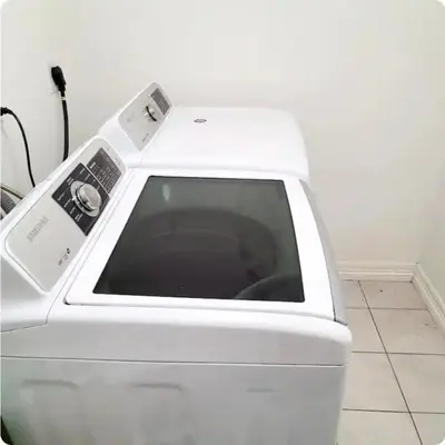 a white washing machine with a control panel on it at Sweet stay near Denver airport in DEN