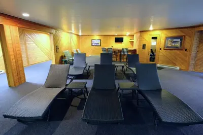 a group of benches in a room with tables and chairs at Keystone Condo, Walking Distance to Ski Lift in Keystone