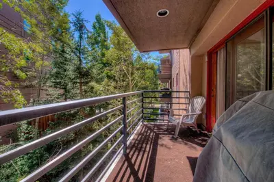 a balcony of a house with a chair on it at Keystone Condo, Walking Distance to Ski Lift in Keystone