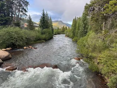 a river with rocks in the middle of it at Keystone Condo, Walking Distance to Ski Lift in Keystone