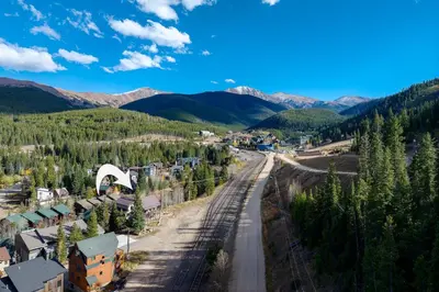 an aerial view of a town with a train on the tracks at Ski Inn Condo condo in Winter Park