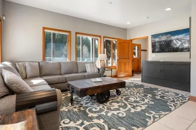 a living room with a couch and a table at Ski Inn Condo condo in Winter Park