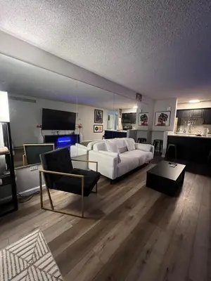 a living room with a bed and a couch at Stylish Stay In Downtown Denver in Denver