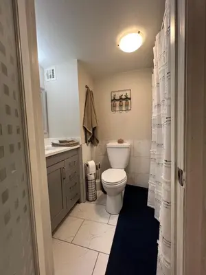 a bathroom with a toilet and a sink at Stylish Stay In Downtown Denver in Denver