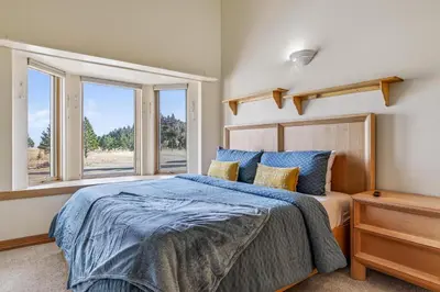a bedroom with a bed and a window at Scenic Mountain Home, Media Room, TT, Gym in Boulder