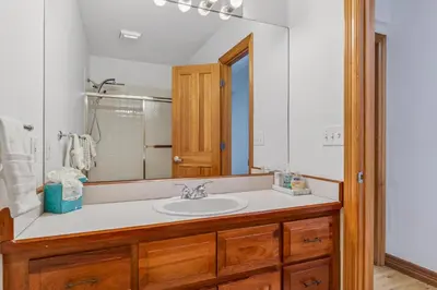 a bathroom with a sink and a mirror at Scenic Mountain Home, Media Room, TT, Gym in Boulder