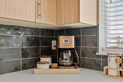 a coffee maker on a counter in a kitchen at Modern Retreat - Close to Old Town in Fort Collins