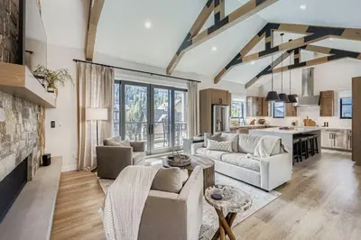 a living room with a couch and a table at 37 Alcove townhouse in Keystone