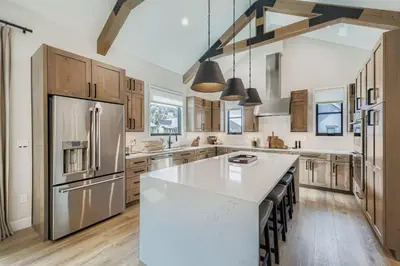a kitchen with a white counter top and a refrigerator at 37 Alcove townhouse in Keystone