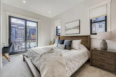 a bedroom with a bed and a large window at 37 Alcove townhouse in Keystone