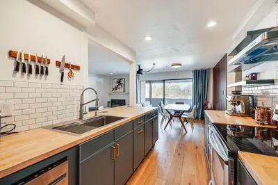 a kitchen with a sink and a counter top at 1 Mi to CU Boulder! Walkable Condo with Indoor Pool in Boulder