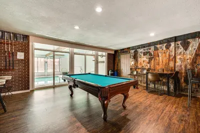 a room with a pool table in it at 1 Mi to CU Boulder! Walkable Condo with Indoor Pool in Boulder