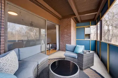a living room with a couch and a fire place at 1 Mi to CU Boulder! Walkable Condo with Indoor Pool in Boulder