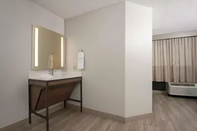 a bathroom with a sink and a mirror at Hyatt Place Denver Tech Center in Centennial