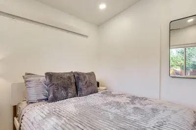 a bedroom with a bed and a window at New Luxury Modern Riverside Scandinavian Cabin in Breckenridge