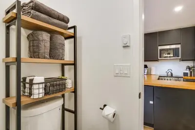 a kitchen with a washer and dryer in a room at New Luxury Modern Riverside Scandinavian Cabin in Breckenridge