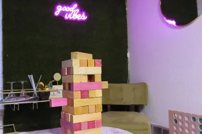 a tower of wooden blocks on a table in a room at Modern Luxe Stay • Bright & Photo-Ready in Westminster