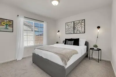 a white bedroom with a large bed and a window at Modern Luxe Stay • Bright & Photo-Ready in Westminster